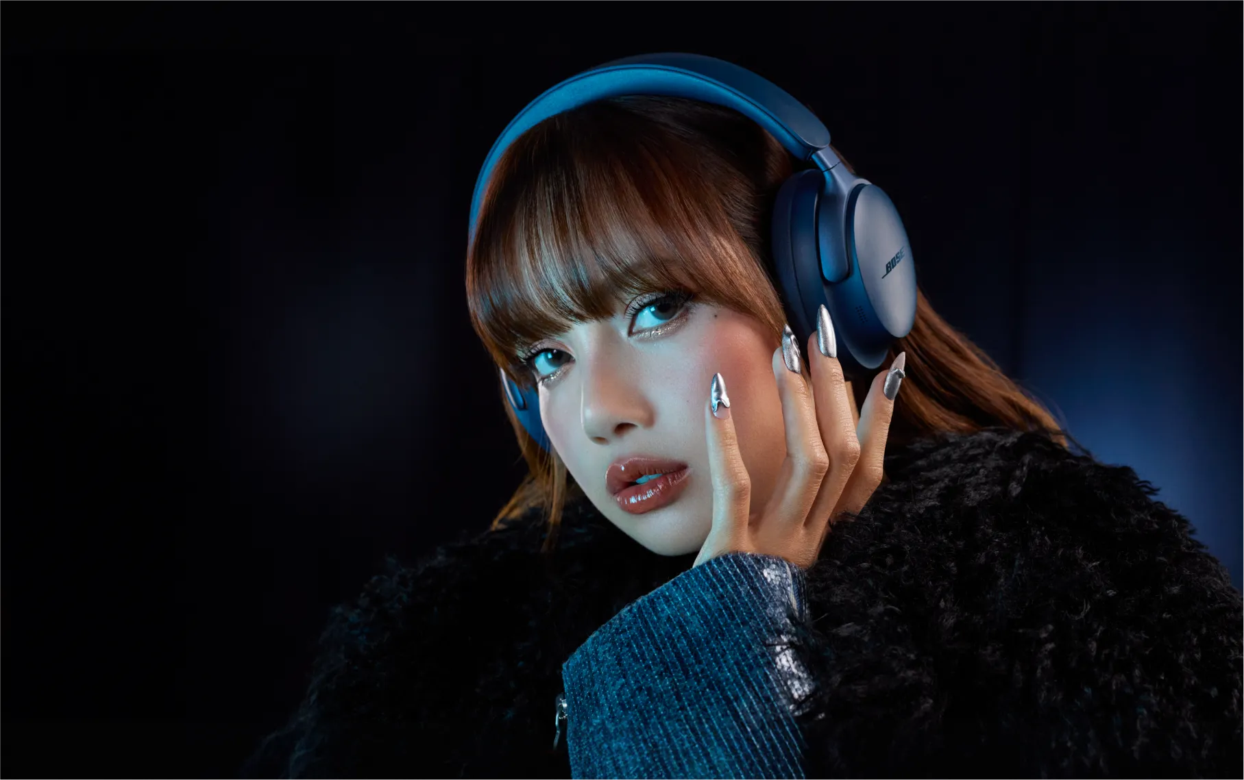 LISA wearing Bose QuietComfort Ultra Headphones in Lunar Blue, available in QuietComfort Ultra Headphones and Earbuds, and Ultra Open Earbuds.